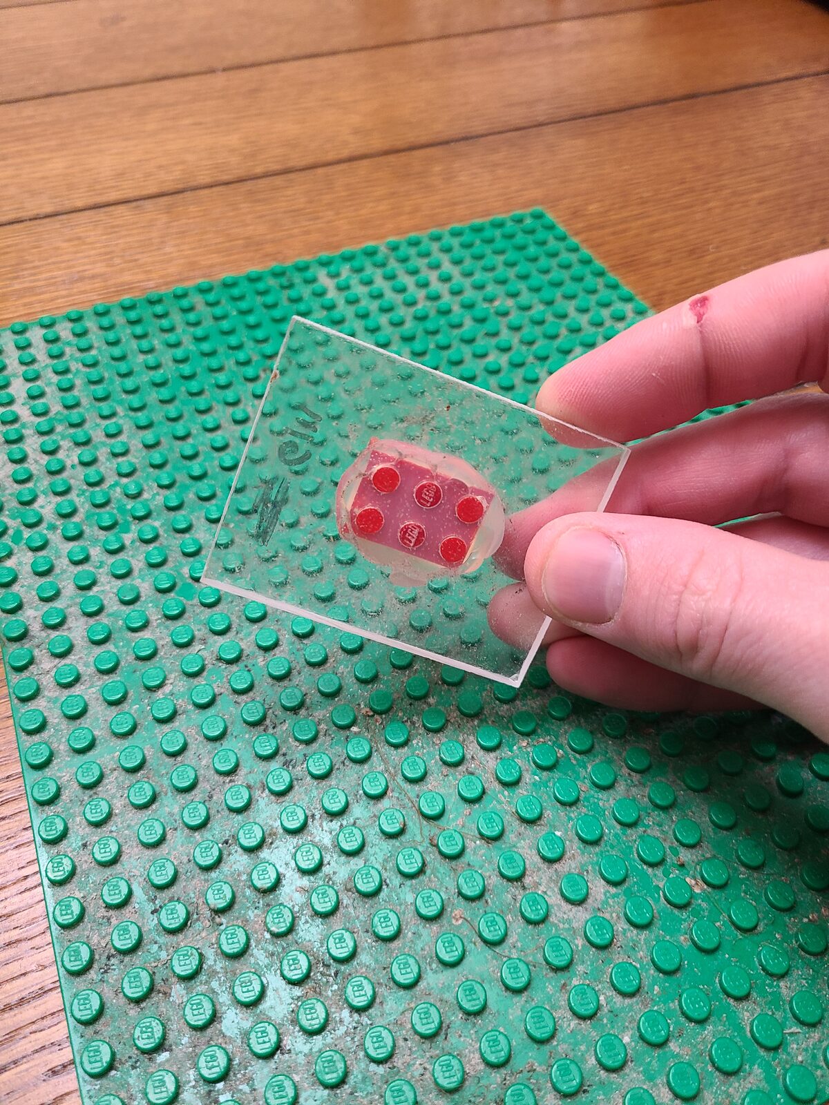 The acrylic block being snapped onto the baseplate